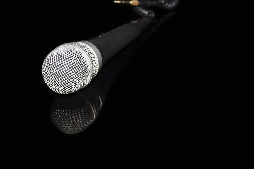 microphone laying down on a black table