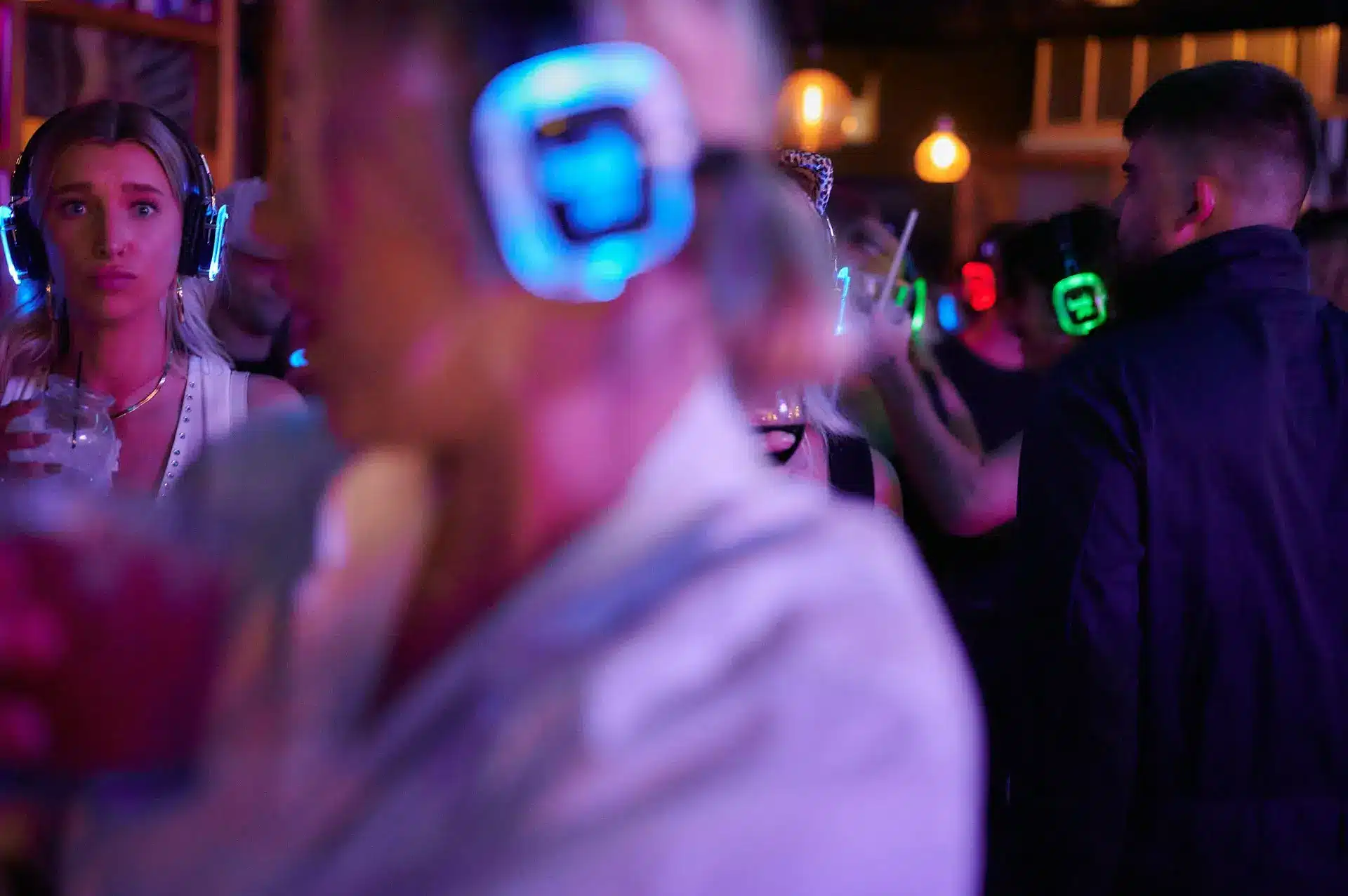 crowd of people at a silent disco party crowd of people at a silent disco party